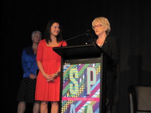 Natalie Miller presents the inaugural award to Rachel Okine